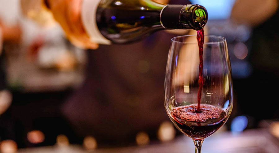 wine being poured into a glass