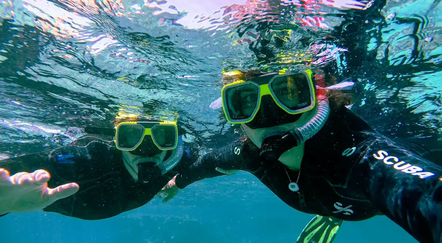 two people snorkeling in the ocean